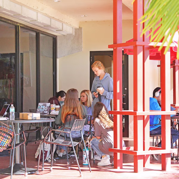 Students enjoying outdoor seating at Tutu's cafe