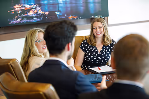 students meeting in the board room