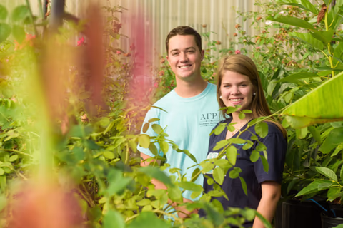two students in a horticulture lab