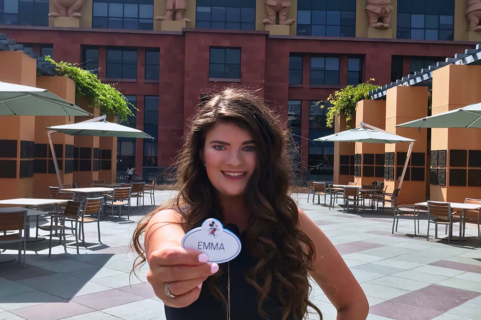 student in front of disney casting building