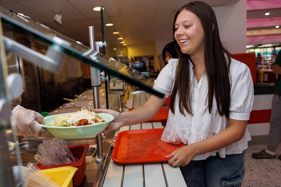 Student ordering bowl of food
