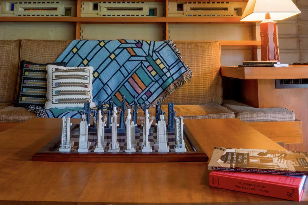 various merch, including books, pillows, a chess board, and books