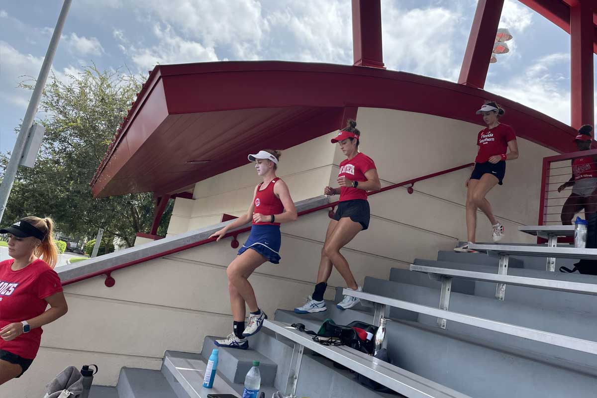 Women’s Tennis Team Run down steps
