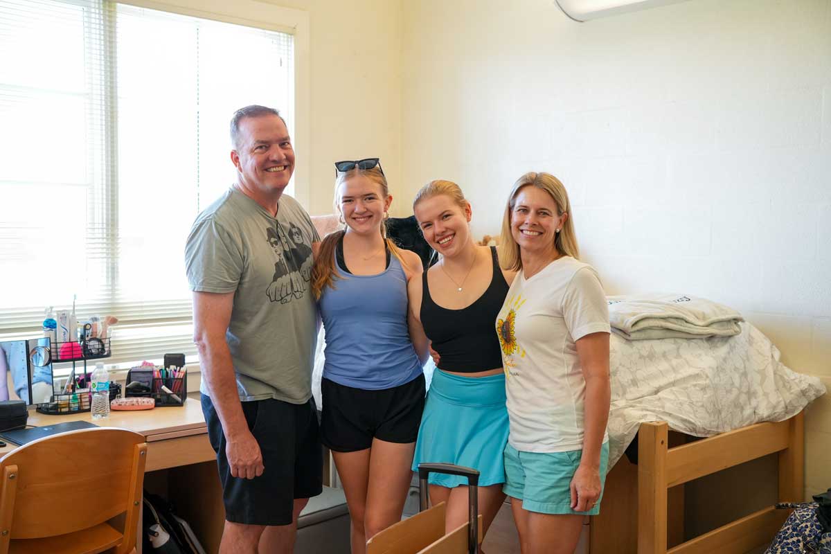 Family with their student in the dorms