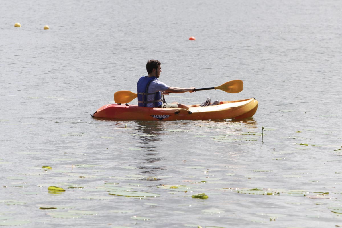 student paddling on a kayak in Lake Hollingsworth