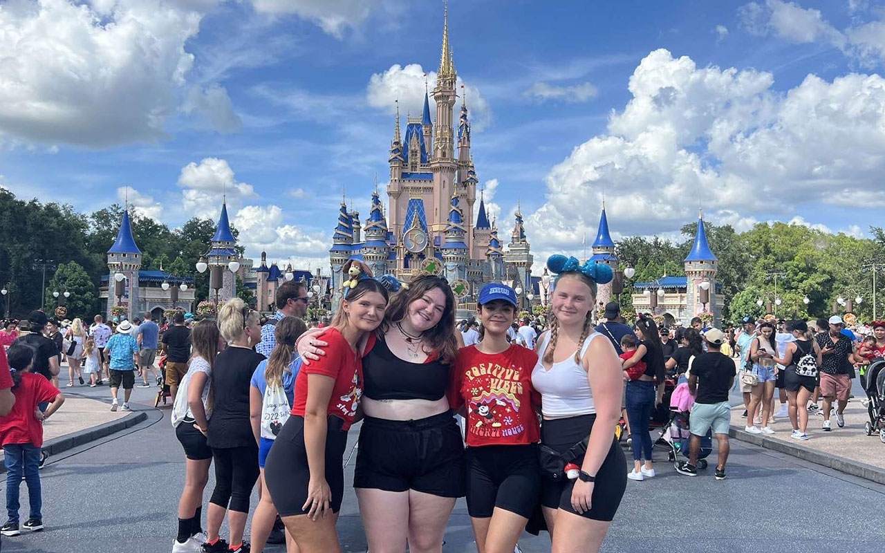 Students at Disney World in front of castle