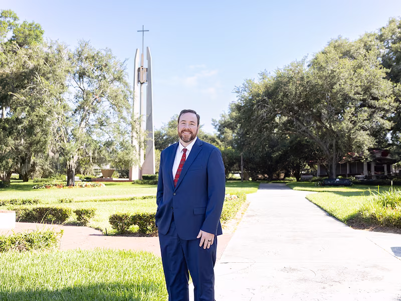 Dr. Martin stands outside