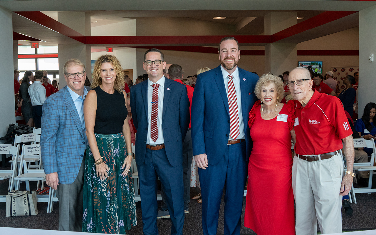President Martin and others at the ribbon cutting for the Adams Athletic Performance Center