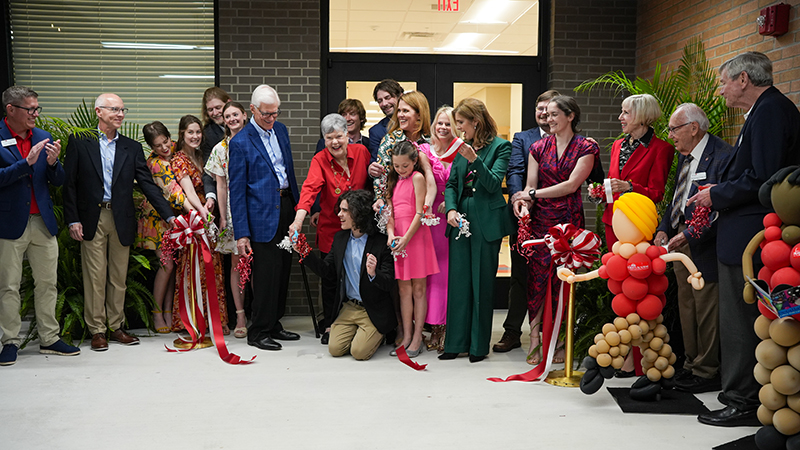 members of the Roberts family and others cutting the ribbon