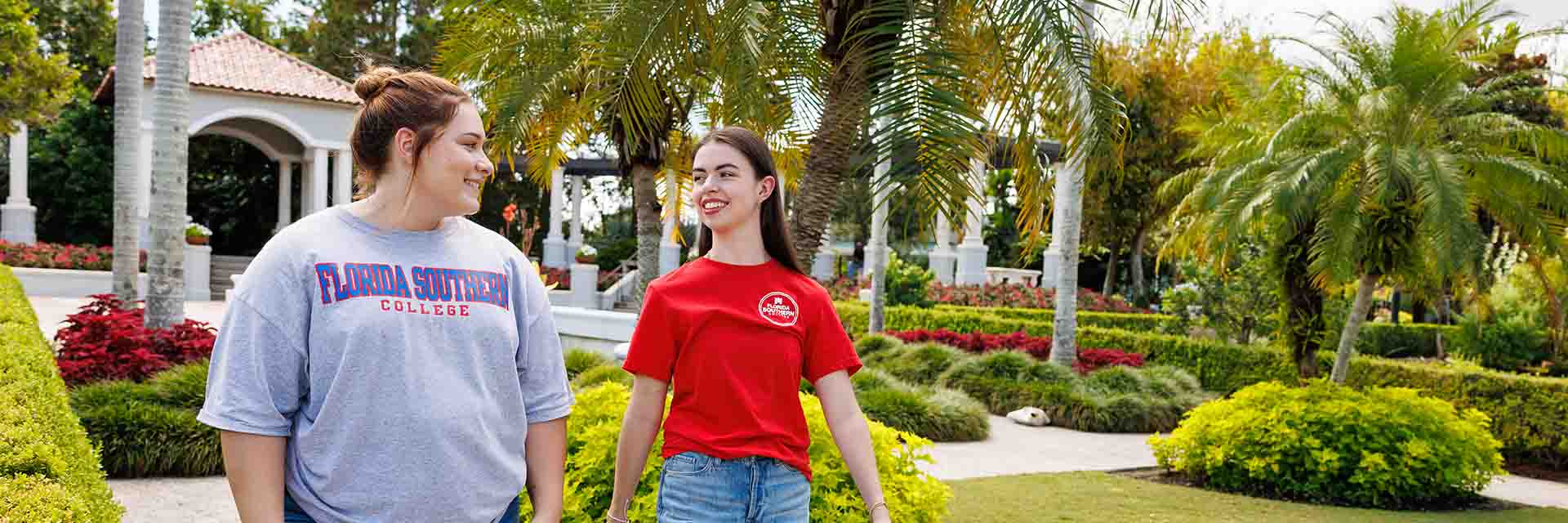 two students strolling through Hollis Garden