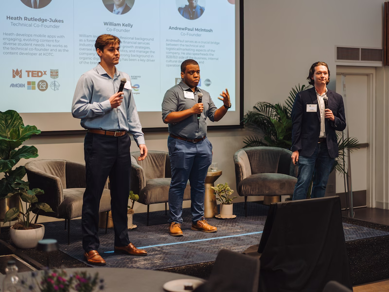  the alumni speaking on stage