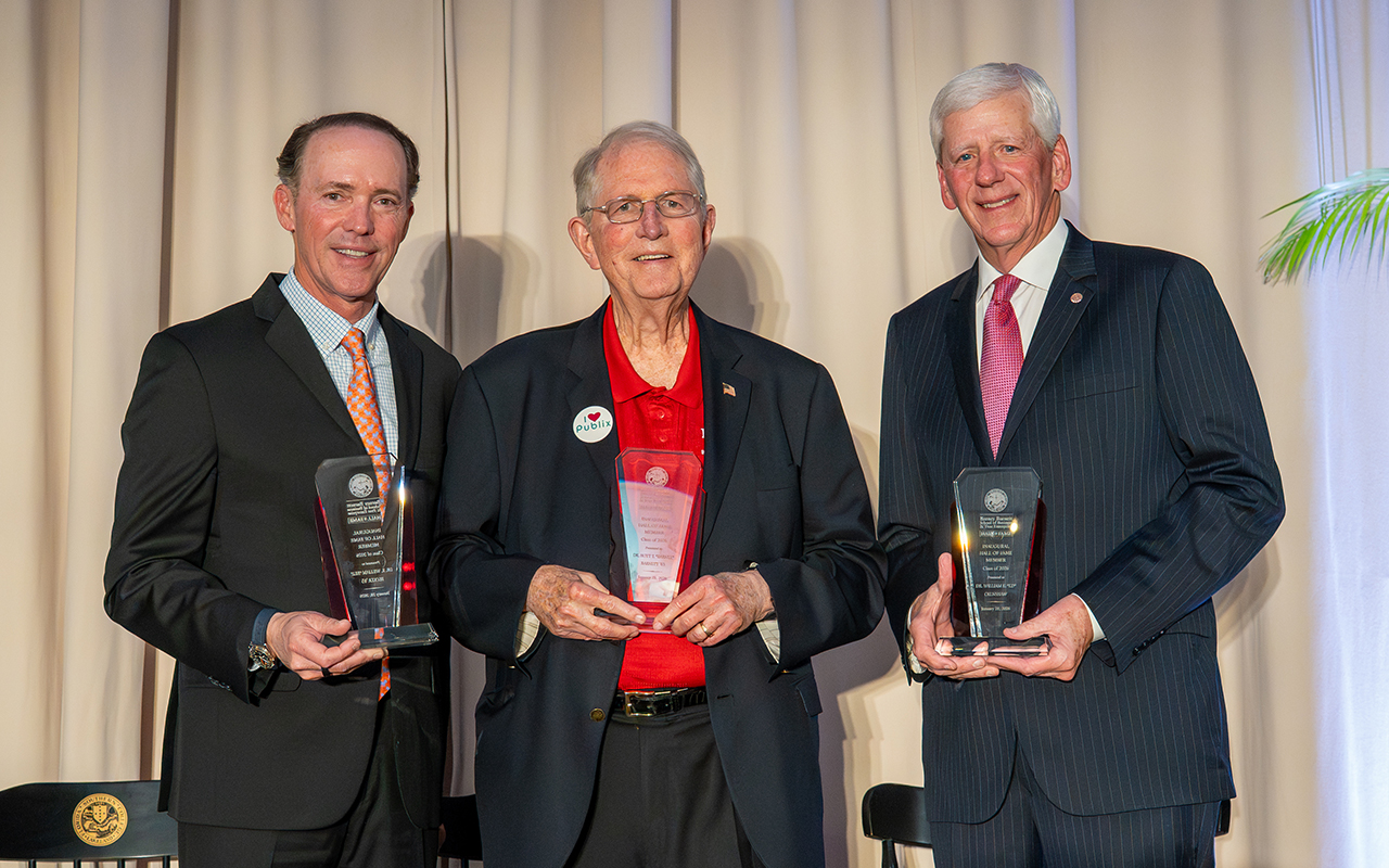 Barnett, Becker, and Crenshaw with awards