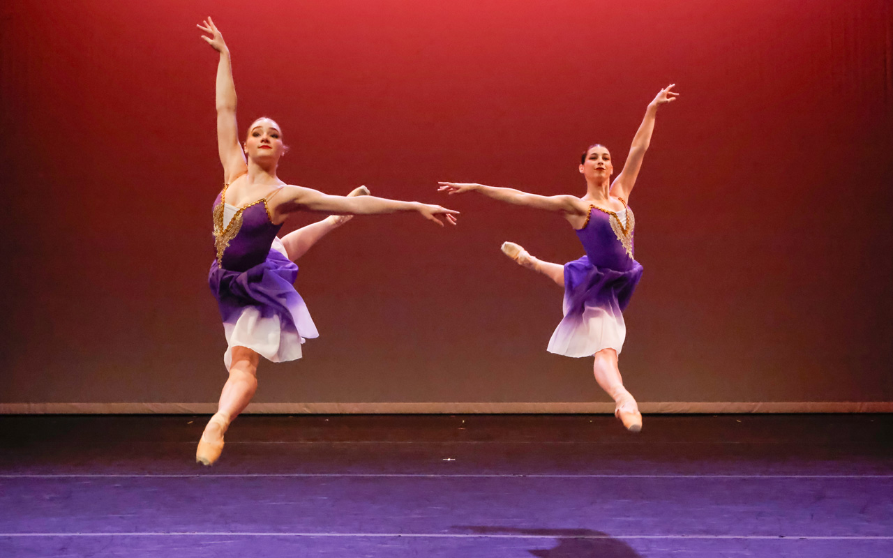 two dancers performing on stage