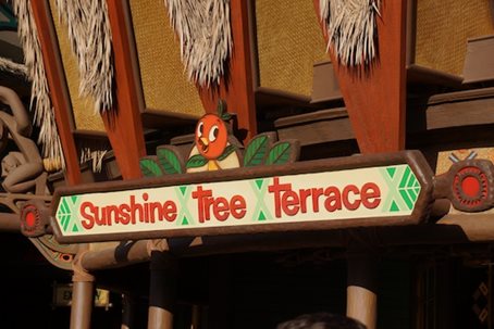 The sign for the Sunshine Tree Terrace, featuring the Orange Bird on top