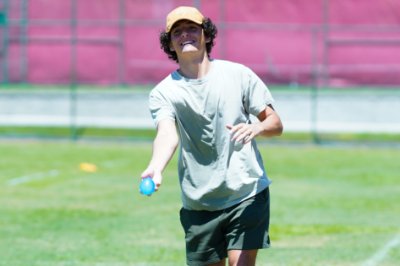 Student tossing a water balloon during Frank Lloyd Wright Day event.