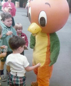 The Orange Bird mascot with a group of children